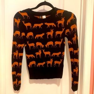 Sparkly orange and black animal pull over sweater